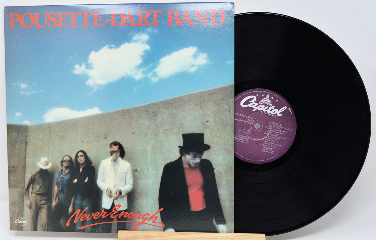Vinyl record with 'Pousette Dart Band' album cover showing a group of people against a blue sky.