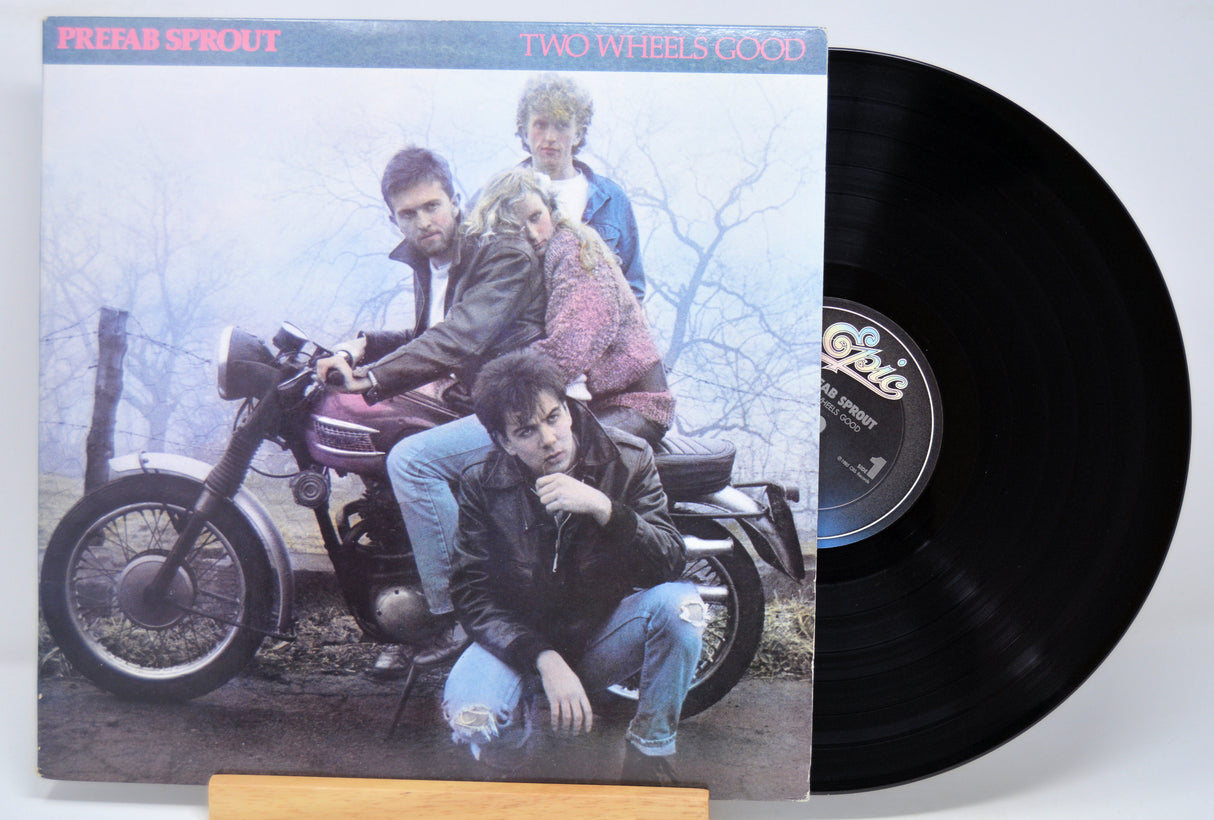 'Prefab Sprout Two Wheels Good' Vinyl record with a cover featuring three people on a motorcycle
