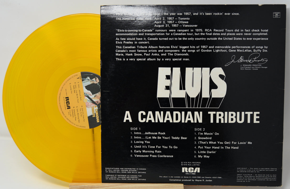 Yellow vinyl record with black cover featuring 'Elvis: A Canadian Tribute' text