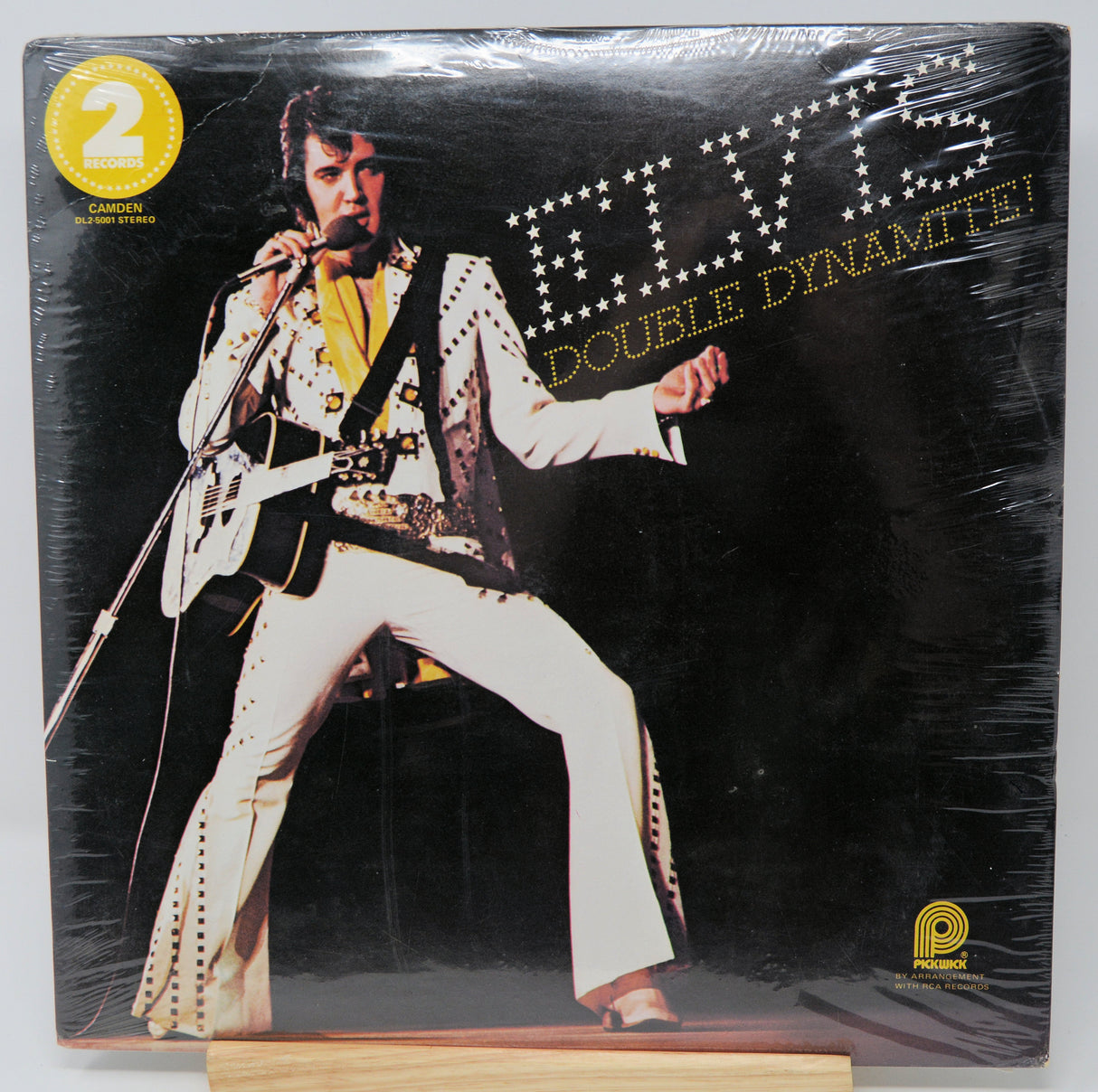 Vinyl record cover featuring an Elvis Presley image with 'Double Dynamite!' text.