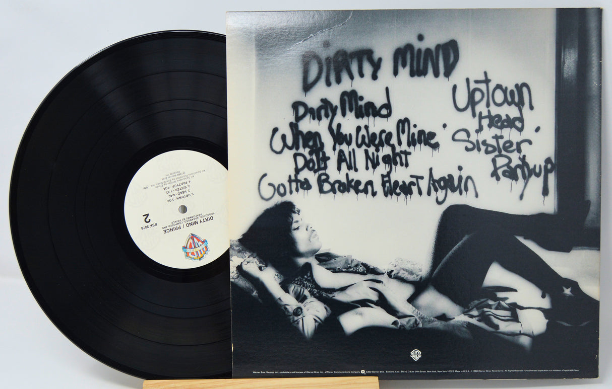Vinyl record with cover featuring artistic design and text