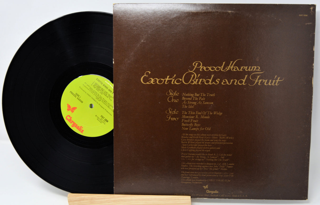 Vinyl record with a brown cover featuring text and a green label on a white background
