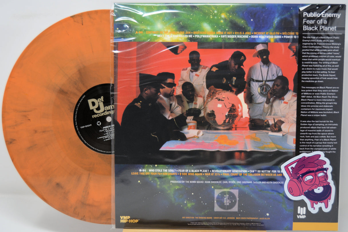 Orange vinyl record by Public Enemy titled 'Fear of a Black Planet' with a colorful album back cover featuring a group of people around a table.