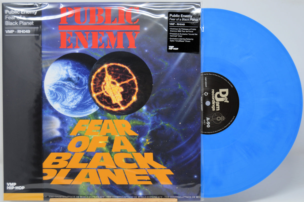 Blue vinyl record with 'Public Enemy' 'Fear Of A Black Planet' album cover featuring space-themed design.