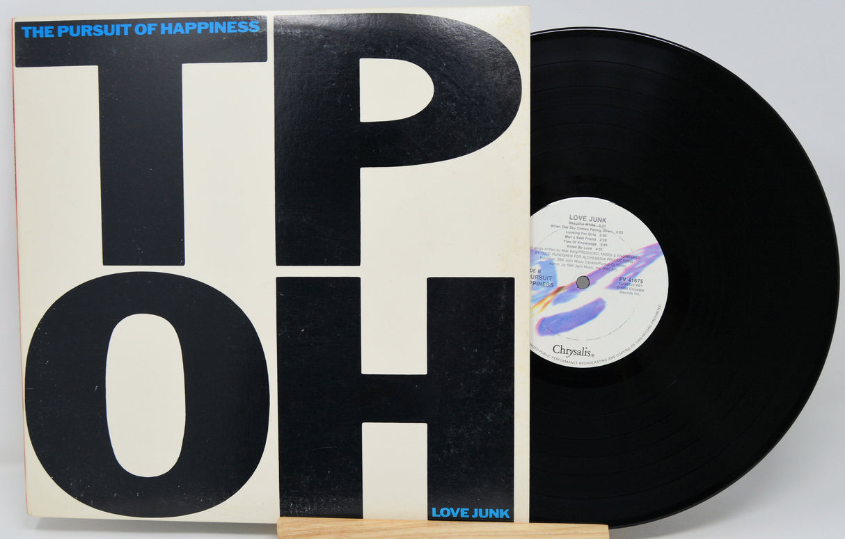 Vinyl record with 'The Pursuit of Happiness' cover and 'LOVE JUNK' label.