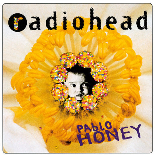 Radiohead - Pablo Honey album cover featuring a close-up of a flower with a portrait in the center.