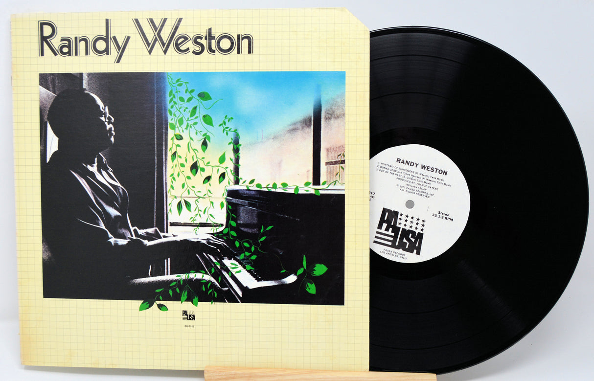 Vinyl record with cover featuring a silhouette of a person playing piano, titled 'Randy Weston'.