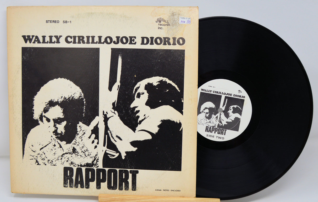 Front cover of 'Rapport' album by Wally Cirillo & Joe Diorio alongside the vinyl record