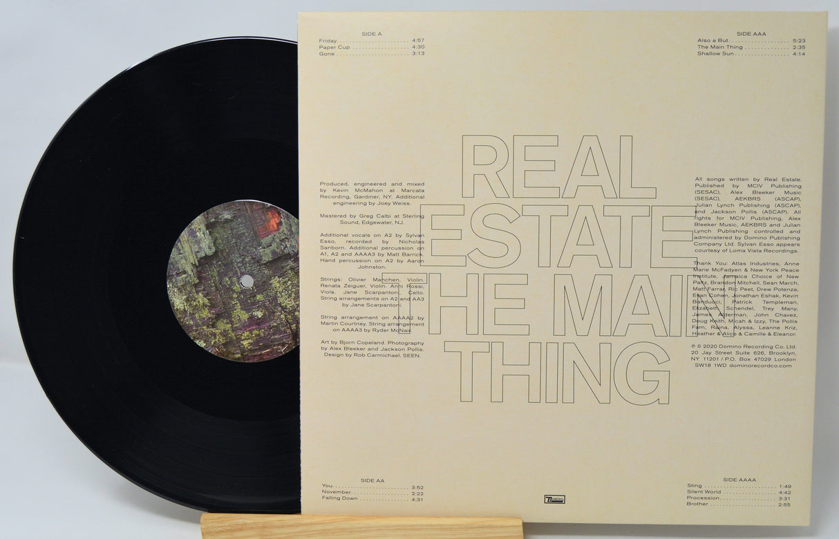 Vinyl record with a textured cover displaying text and a logo.
