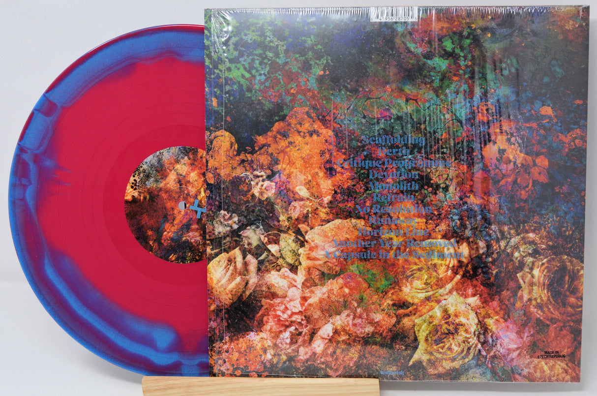 Limited edition marbled vinyl record in red and blue with vibrant floral cover art and tracklist