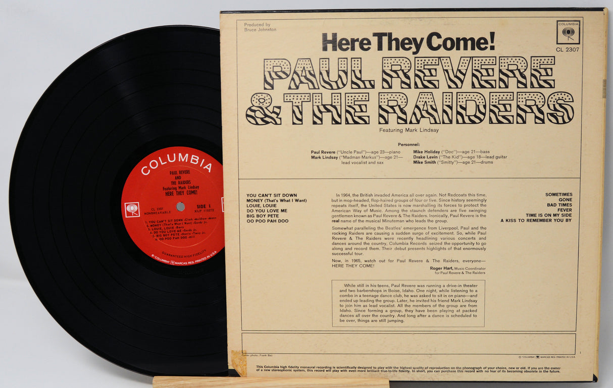 Vinyl record with 'Here They Come!' by Paul Revere & The Raiders and Columbia label.