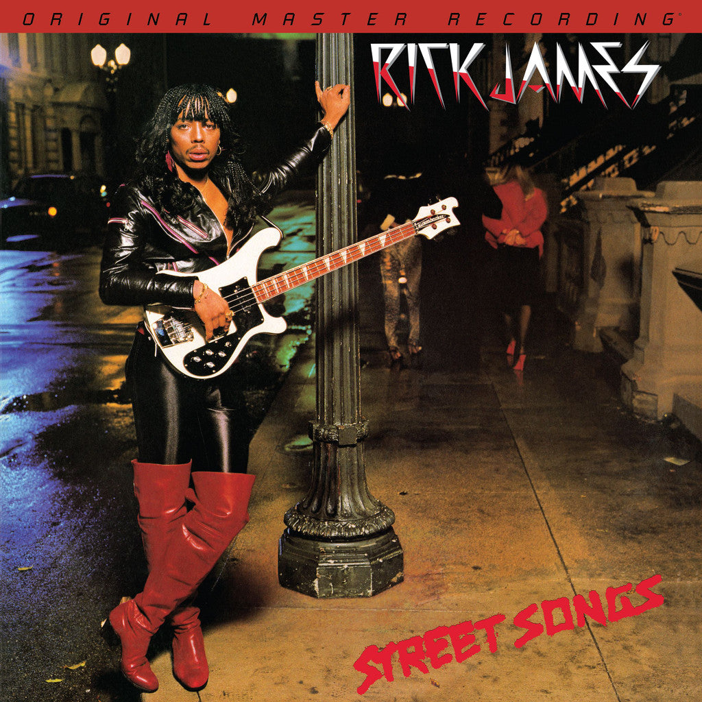 Rick James leaning against a streetlamp with a guitar on the Street Songs album cover