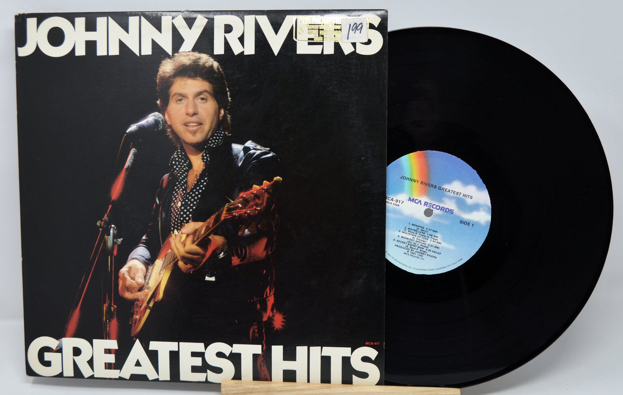 Vinyl record with Johnny Rivers' 'Greatest Hits' on a white background