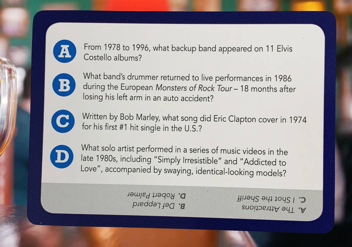 Music trivia question card featuring queries about famous rock bands and artists