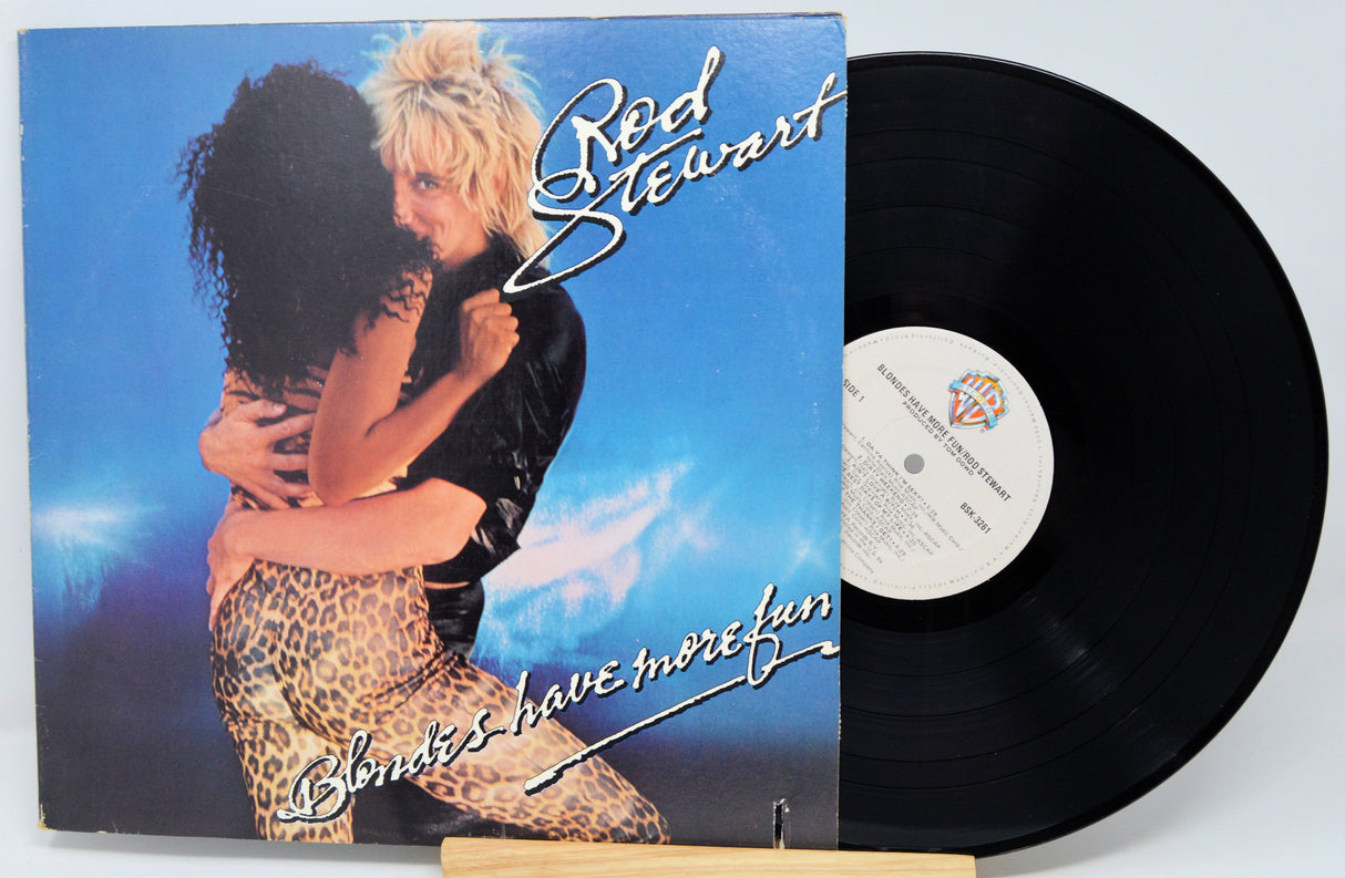 Vinyl record with cover featuring a couple and 'Red Stewart' on a blue background