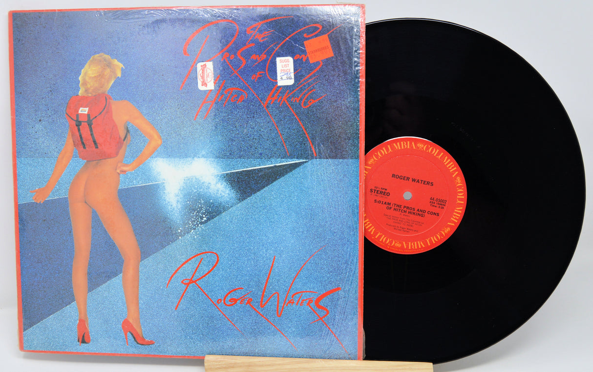 Vinyl record with a colorful cover featuring a stylized illustration of a woman.