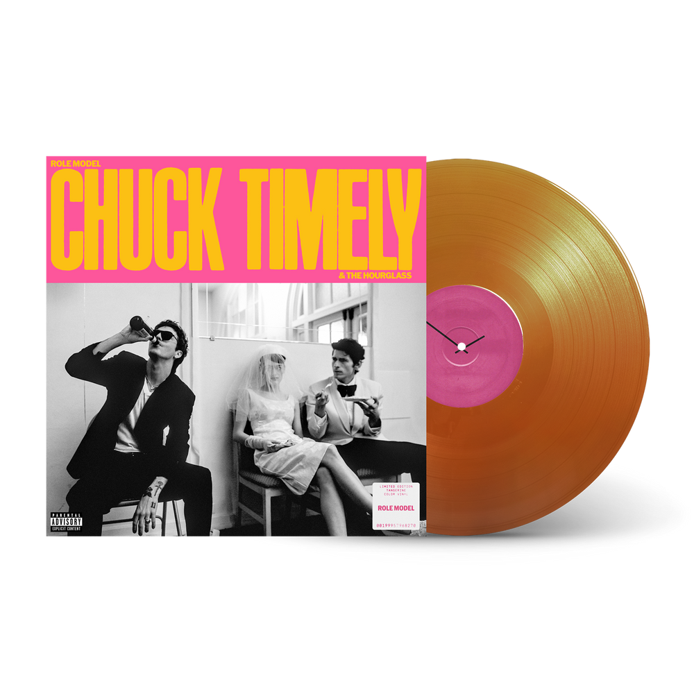 Vinyl record with a pink label and orange disc on a white background