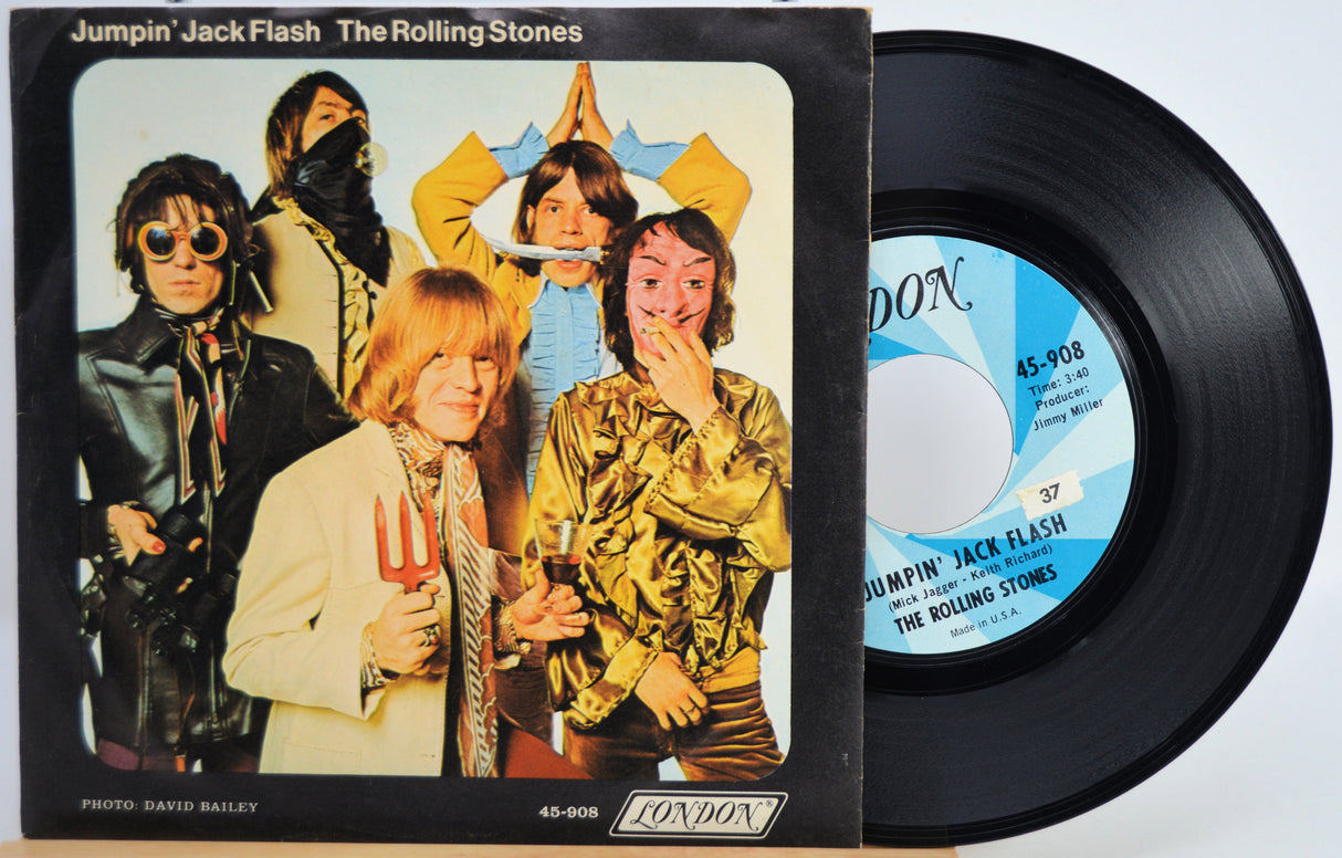 Rolling Stones 'Jumpin Jack Flash' vinyl record with cover featuring band members and London Records label.