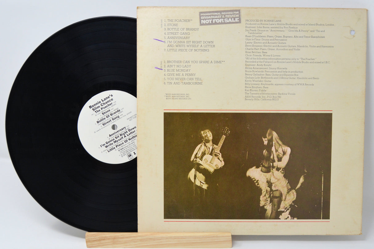 Back cover of Ronnie Lane's Slim Chance vinyl LP with record partially out and tracklist visible