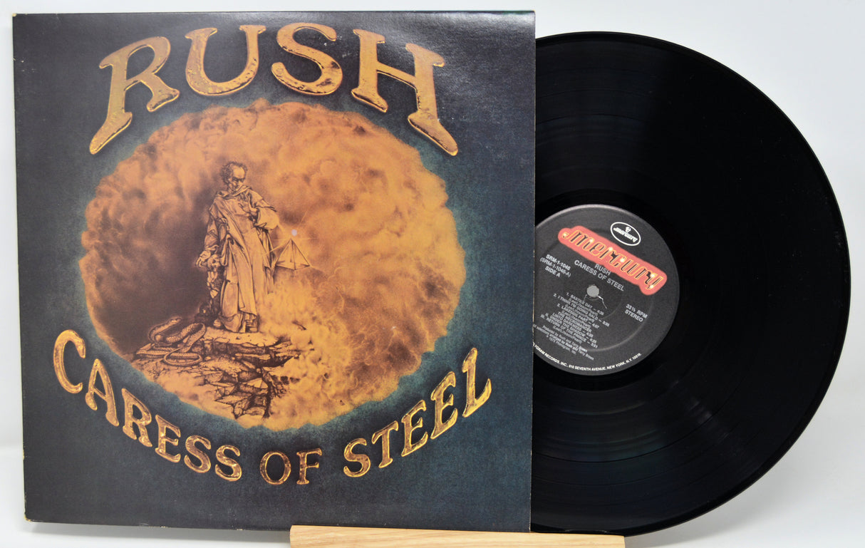 Vinyl record with 'Caress of Steel' by Rush on a white background