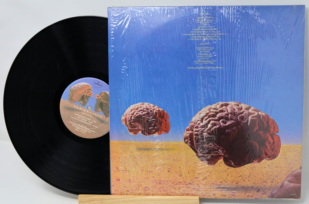 Vinyl record with a brain-themed cover on a white background