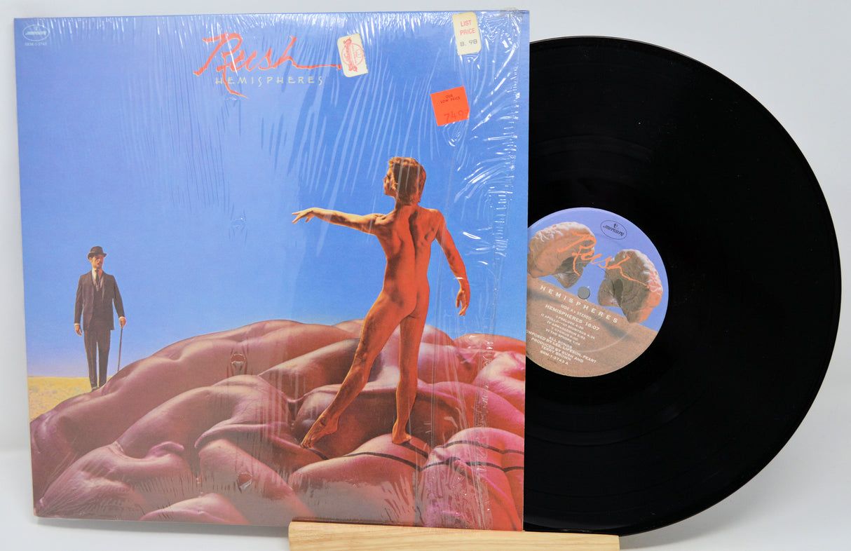 Vinyl record with a colorful cover featuring a person on a rocky landscape.