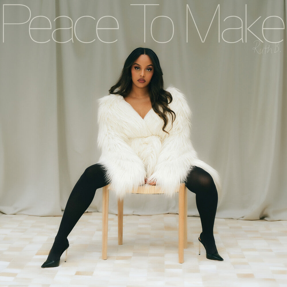 Person wearing a white fur coat sitting on a chair with text overlay
