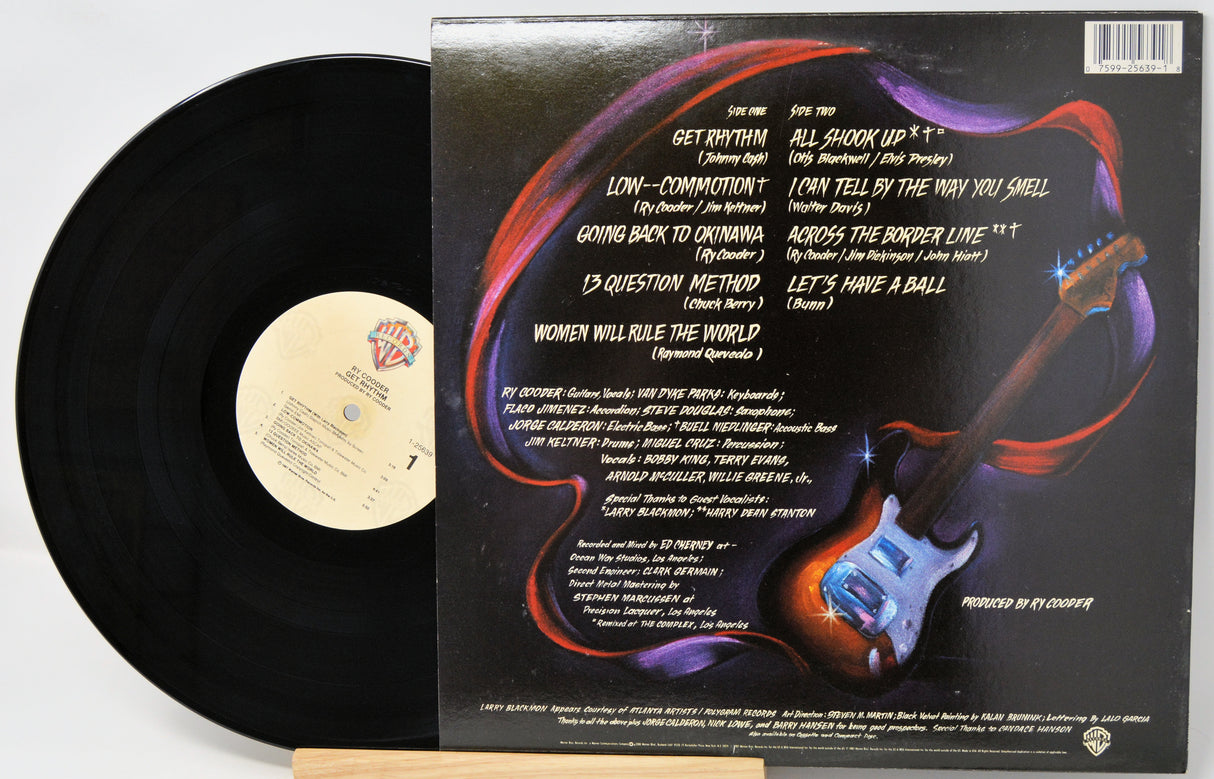 Vinyl record with cover featuring a guitar illustration and tracklist.