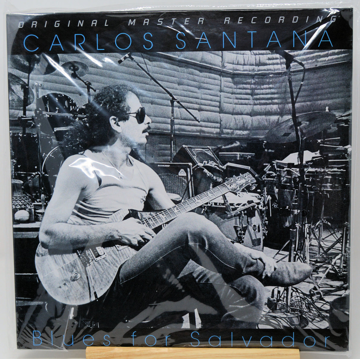 Carlos Santana 'Blues for Salvador' original master recording vinyl LP cover, featuring a black and white photo of Santana playing guitar in a studio setting.