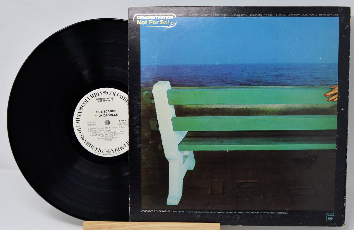 Vinyl record with cover featuring a person on a bench by the ocean, Boz Scaggs album.