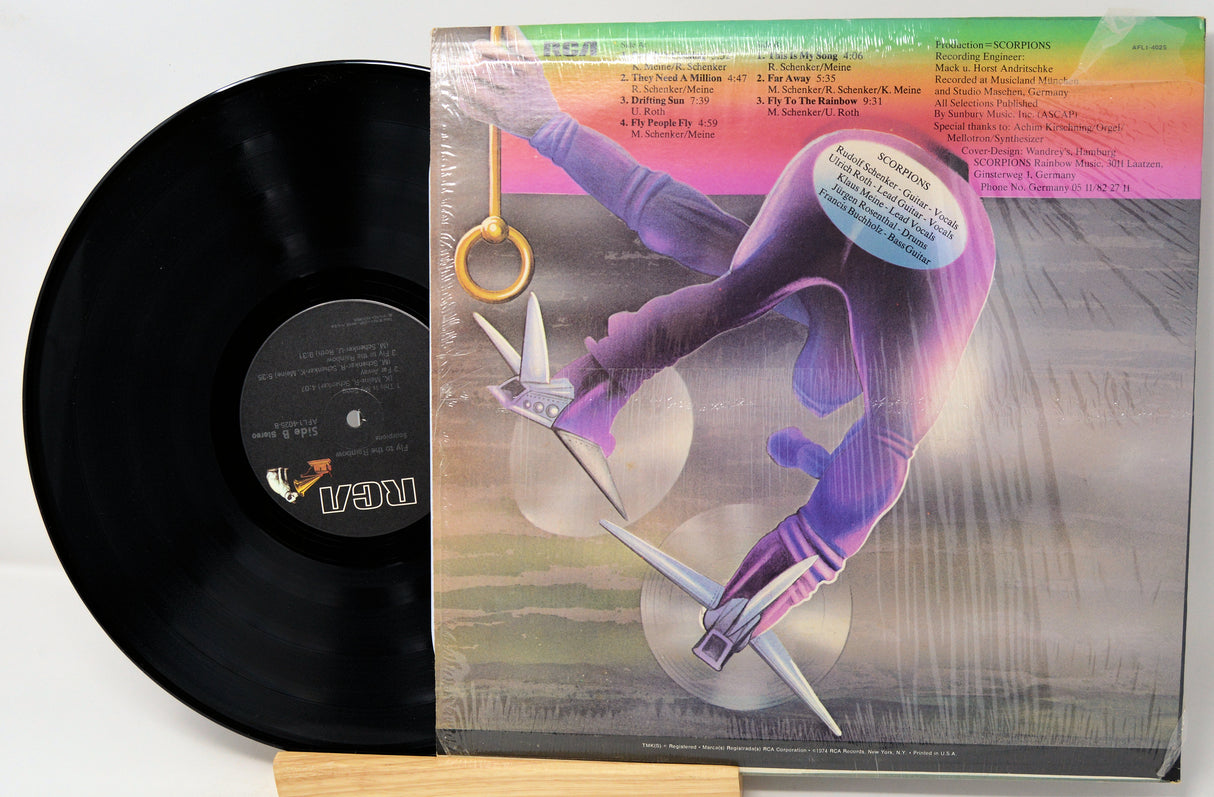 Vinyl record with a colorful album cover featuring a stylized figure.