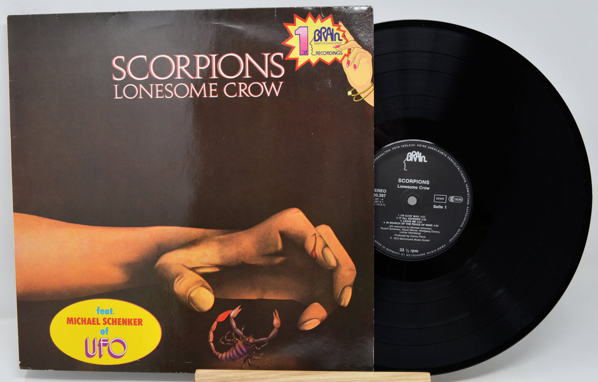 Vinyl record with 'Scorpions Lonesome Crow' album cover showing a hand holding a scorpion.
