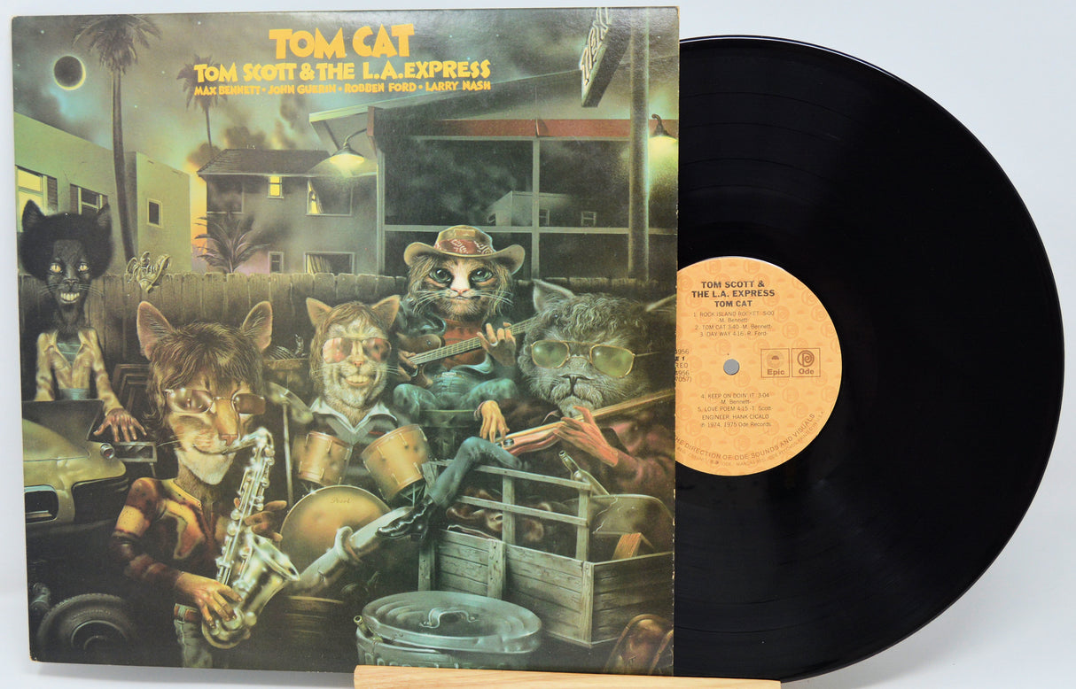 Vinyl record with cover featuring cartoon animals playing instruments inside a car.