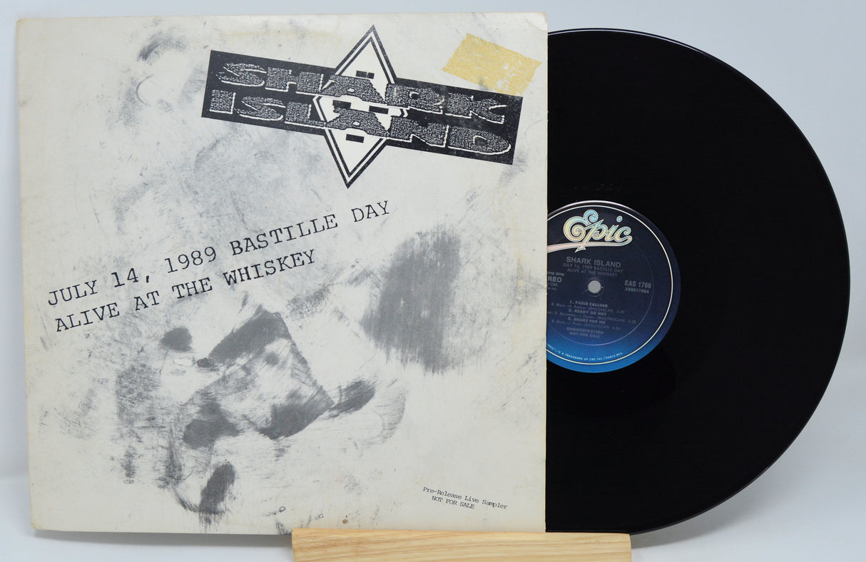 Vinyl record with a black and white cover featuring text and a logo.