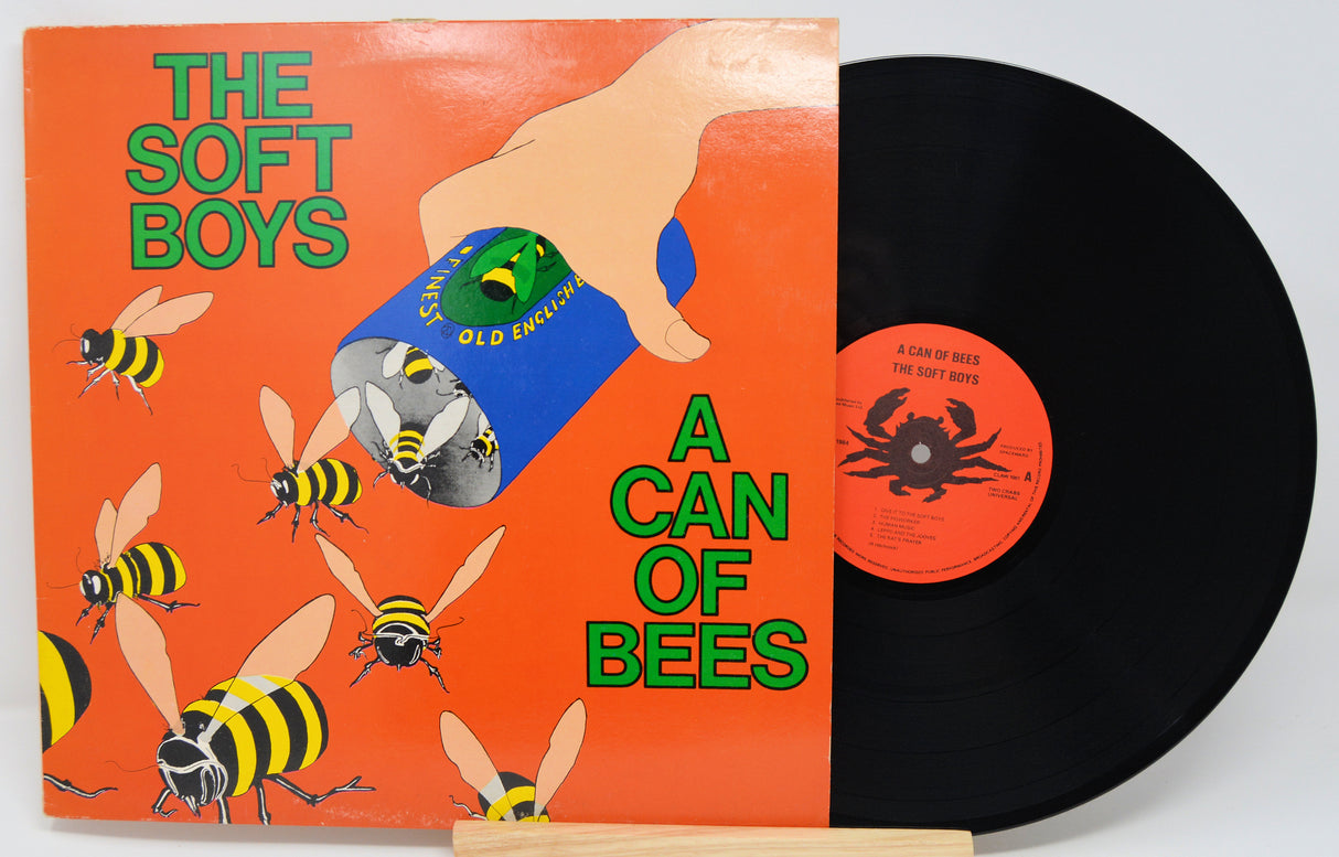 Vinyl record with cover featuring a hand holding a can of bees and text 'The Soft Boys A Can of Bees'.