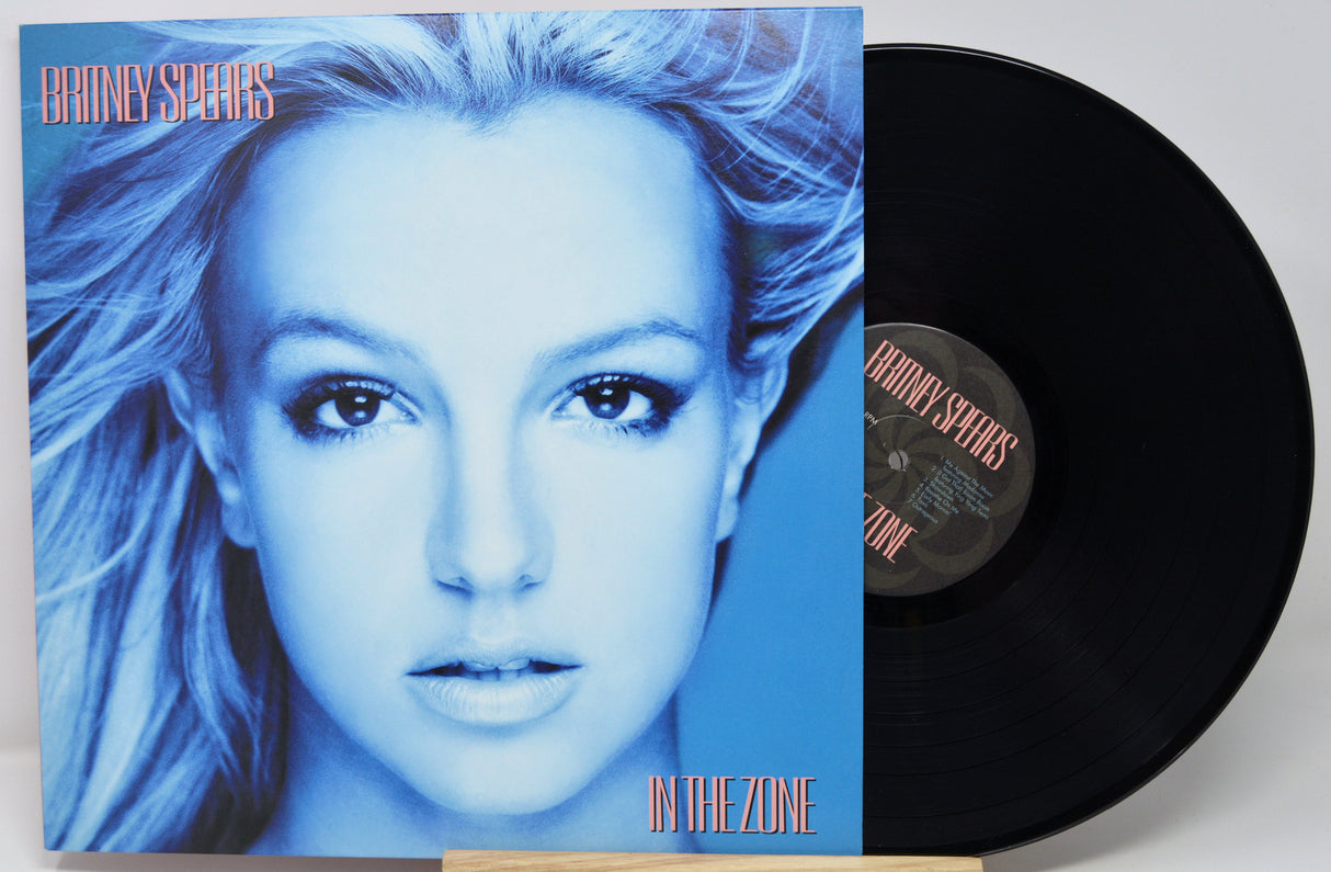 Vinyl record with a cover featuring a person's face on a blue background