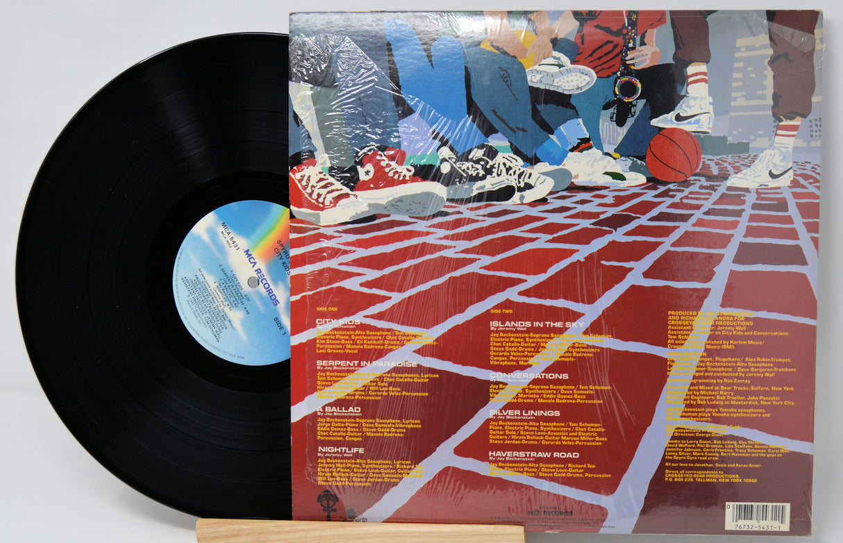 Vinyl record 'Spyro Gyra City Kids' with a colorful album cover featuring sneakers and a grid pattern.