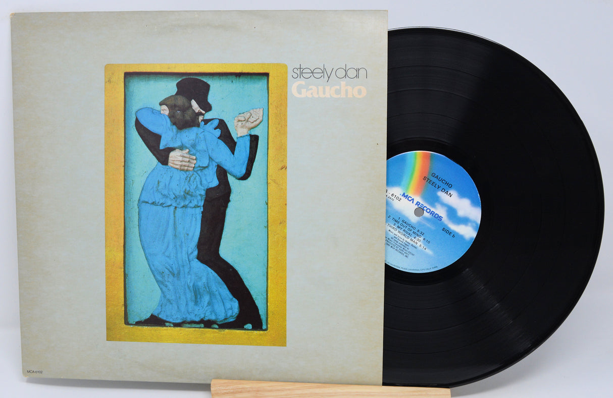 Used vinyl record of Steely Dan's album 'Gaucho' with a picture of a man and woman dancing on the cover.