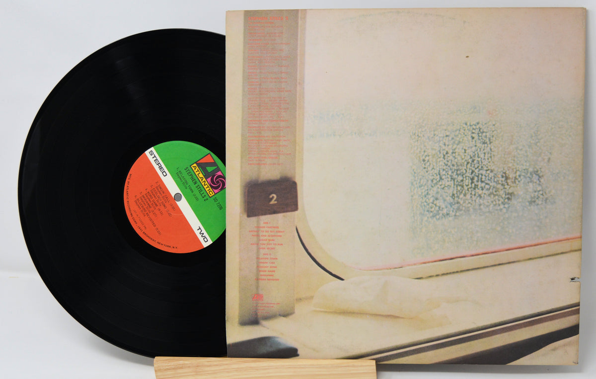 Vinyl record with a colorful label and cover featuring a traditional Japanese scene.
