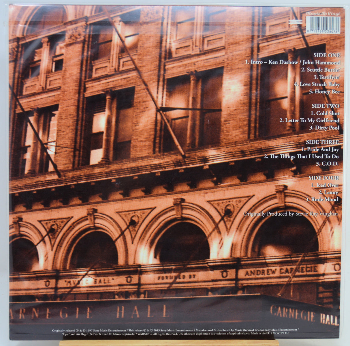 The back cover of a music album featuring a sepia-toned photograph of Carnegie Hall with tracklist text on the right side and a barcode at the top right.