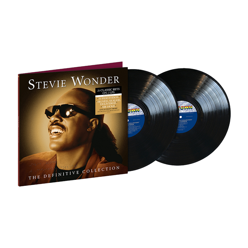 Two black vinyl records and the front cover for 'The Definitive Collection' by Stevie Wonder with a headshot picture of him.
