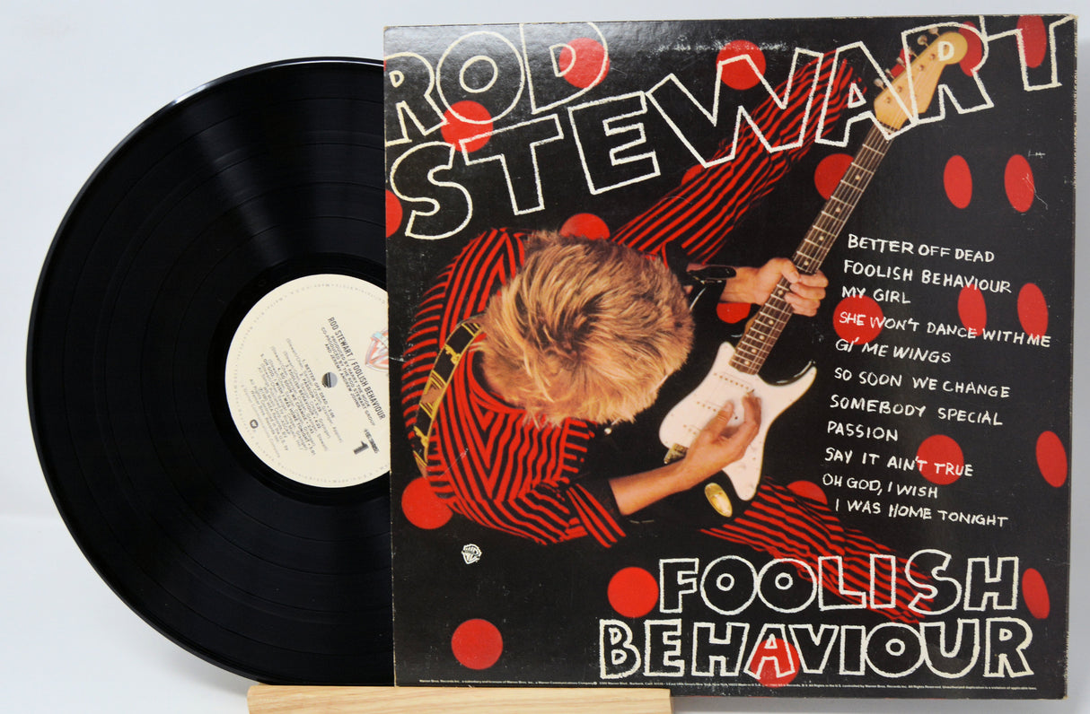 Vinyl record cover with a person and text on a beige background