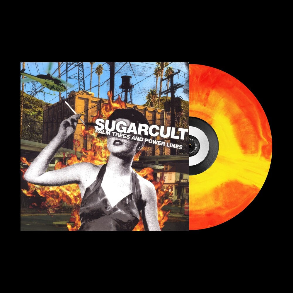 Vinyl record with a colorful design featuring a person and text, set against a background with fire, power lines, a building and helicopter.