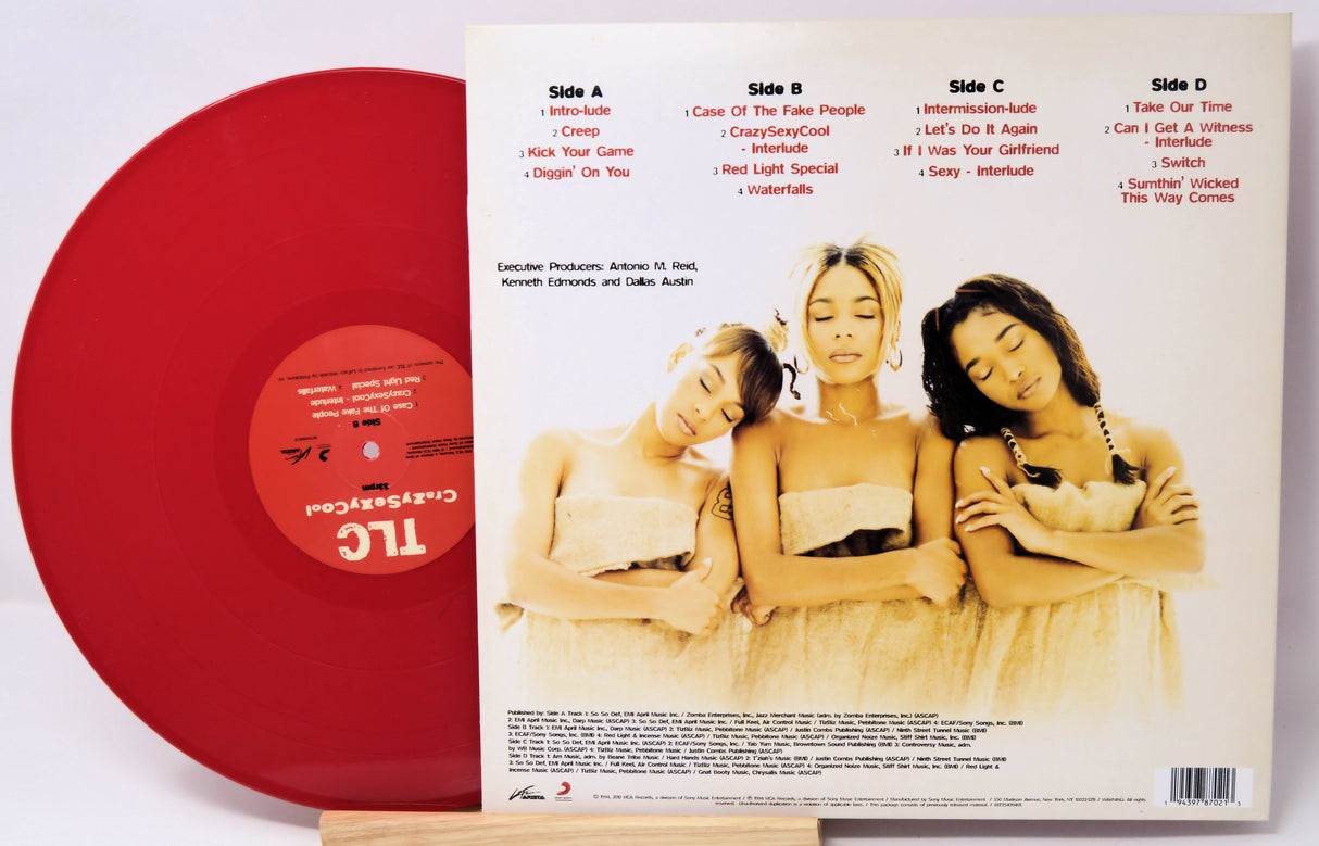 Red vinyl record with a cover featuring three women and track listings.