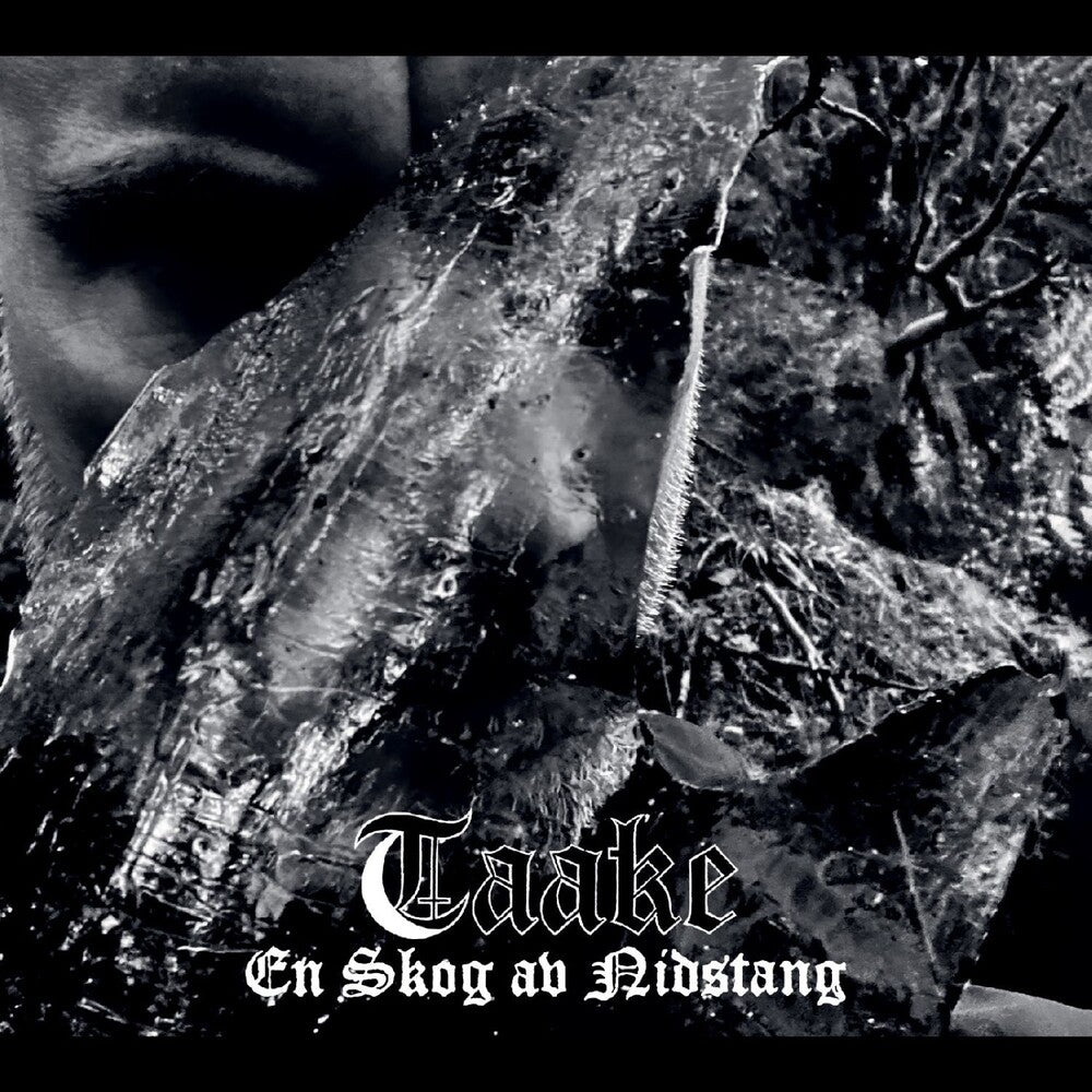 Black and white image of a forest with the text 'Taaake En Skog av Nidstang' displayed.