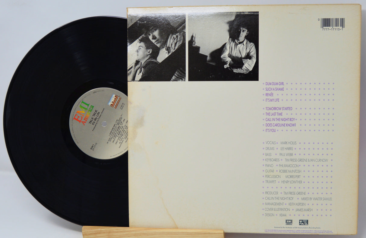 Vinyl record with cover featuring black and white photos and text on a light gray background