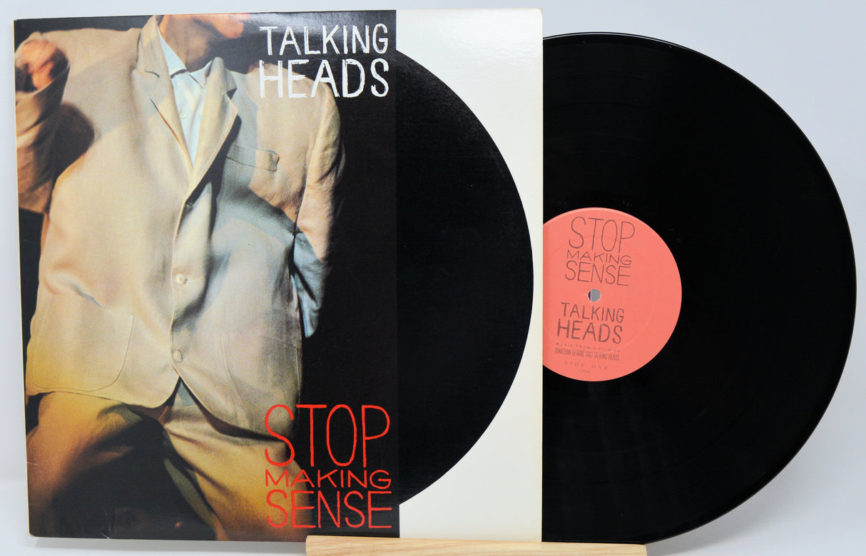 Vinyl record with 'Talking Heads' album cover showing a person in a suit.