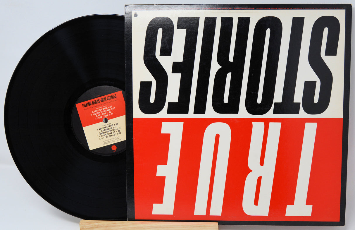 Vinyl record with a red and white cover featuring the text 'STORIES TRUE'.