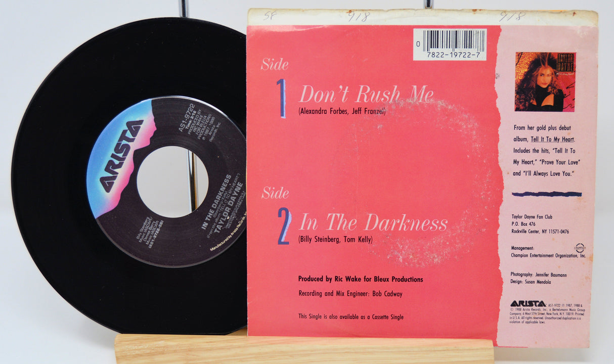 Back cover and vinyl of Taylor Dayne's Don't Rush Me 7-inch single featuring song list and credits