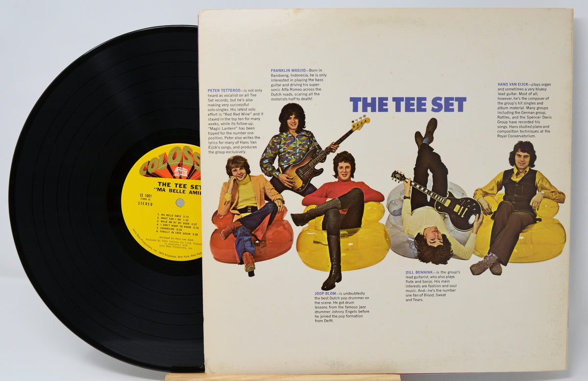 Vinyl record with a colorful cover featuring illustrations of people playing instruments.